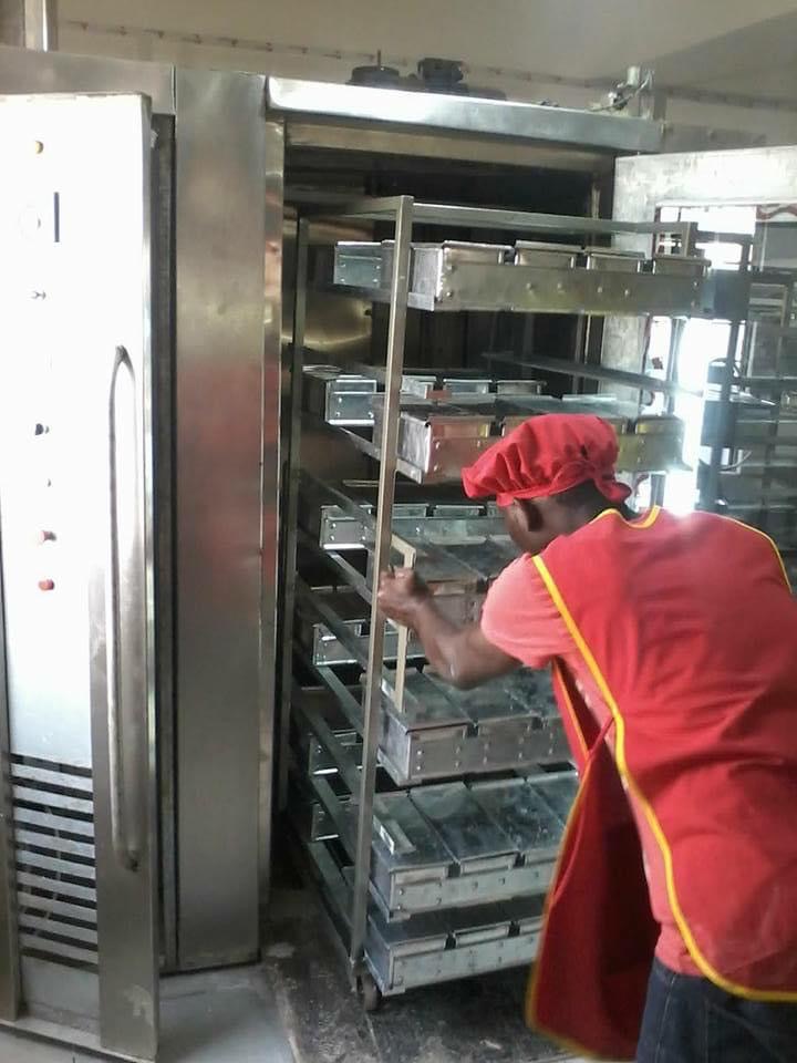 Operator working with a rotary bakery oven